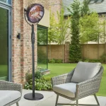Kalos Industrial style floor standing outdoor heater on a patio with Kettler LaMode furniture
