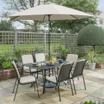 Mesh 6 seat table with Savita chairs with stone cushions and parasol