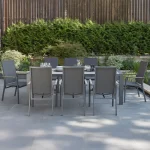 Surf Active 8 seat dining set on a grey marble patio in the garden