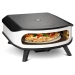 Cozze 17 inch pizza oven with rotating stone cooking a pizza