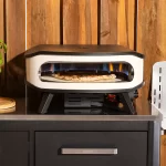Cozze 17 inch pizza oven with rotating stone, side view