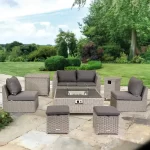 Palma Compact Garden Furniture set in white wash with grey taupe cusions in a garden setting