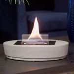 Tenderflame Carnation table top candle with concrete base on a table