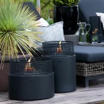 Tenderfame Plettenberg Fire Pit in a garden on wood decking