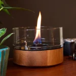 Tenderflame Cafe 18 iin natural wood with large flame on a table