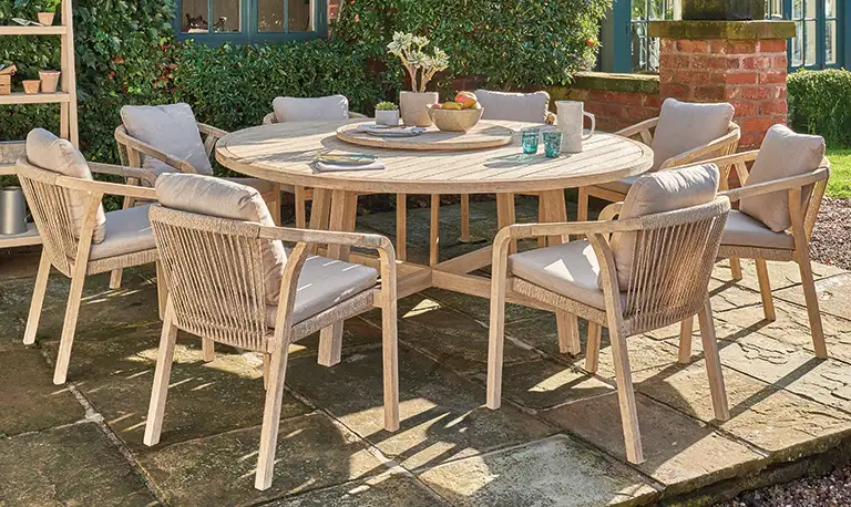 Kettler Cora 8 seat dining set on a stone patio in the garden