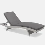 Universal Lounger in white wash with grey taupe cushions on a white background