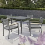 elba 4 seat dining set with surf square table on a white marble patio garden