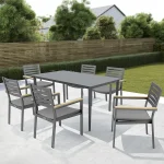 elba 6 seat dining set with surf rectangular table on a white marble patio garden