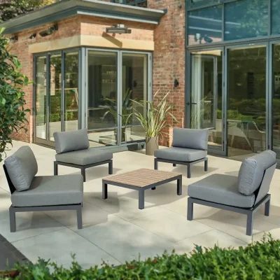 4 x elba side chairs with square coffee table on a modern garden terrace in the sun shine