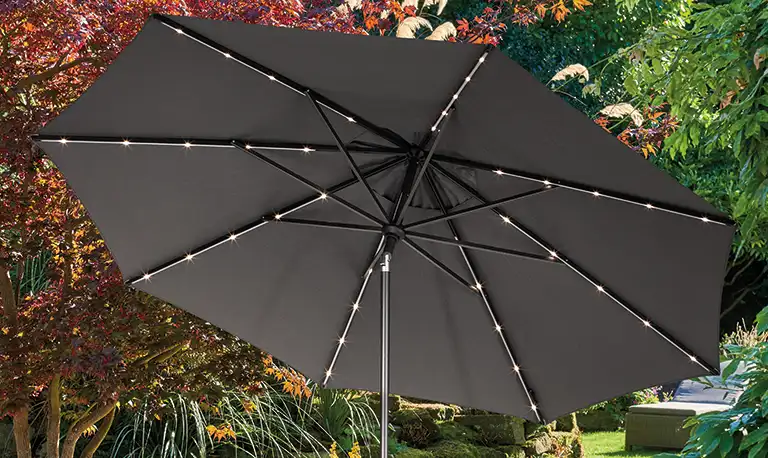 Octagon shaped parasol with led lights in the garden