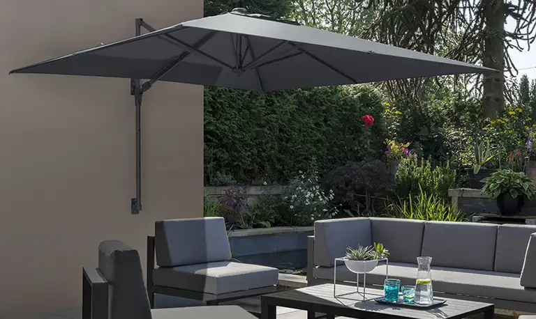 Wall mounted parasol above a versa lounge set